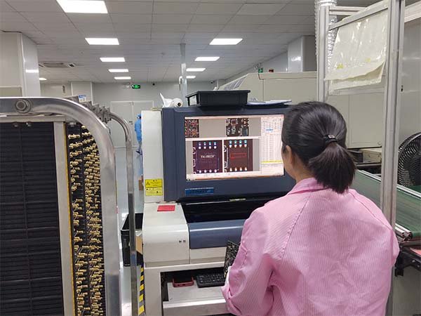 A live video tour of an SMT production line on a laptop screen